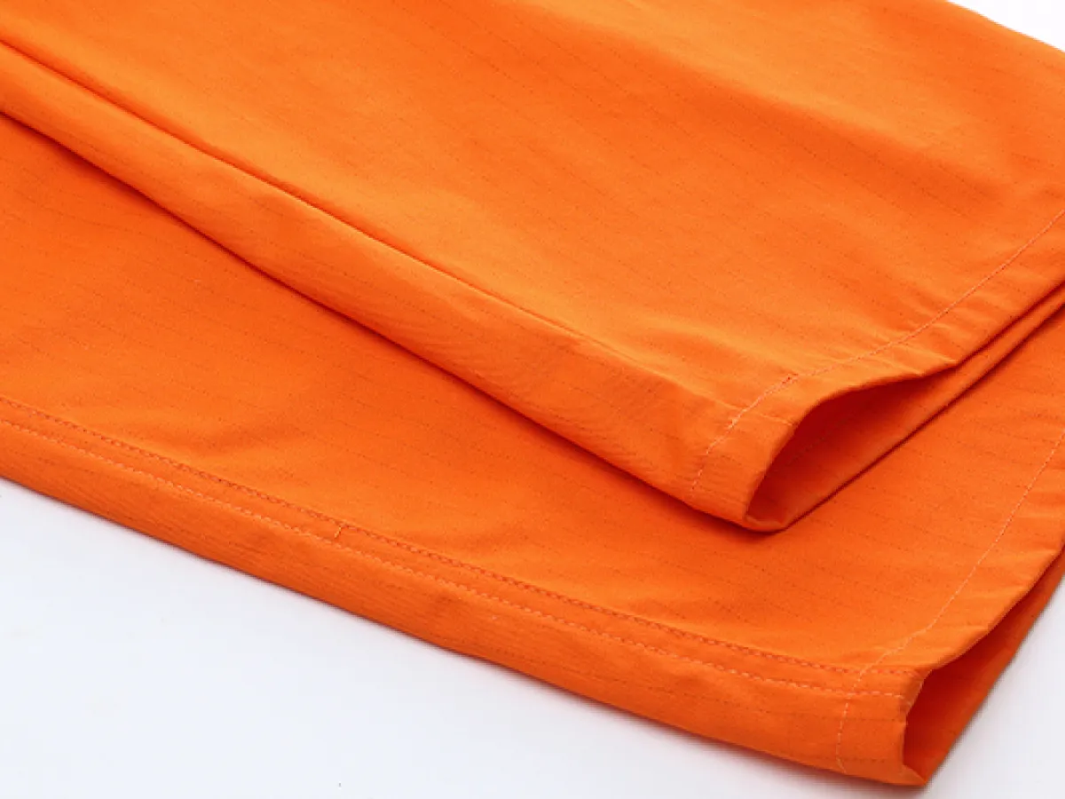When selecting crew coveralls, how can you determine if the fabric is seawater-resistant and salt-fog-resistant